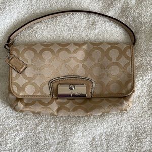 Coach convertible wristlet/clutch purse.